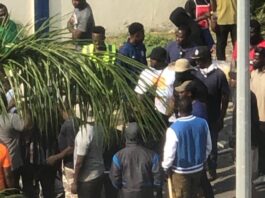 The thugs suspected to be members of the National Democratic Congress at the main gate of Ghana Gas headquarters in Accra.